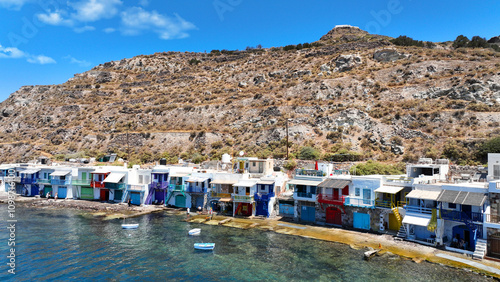 Aerial drone photo of iconic and picturesque fishing village of Klima built by the shore with colourful traditional fishing boat houses called syrmata in island of Milos, Cyclades, Greece photo