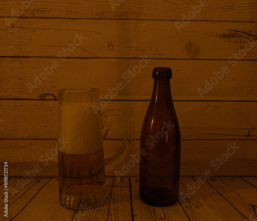 A glass of beer fand an old beerbottle photo