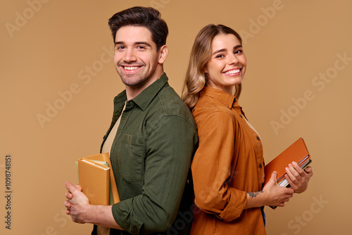 Cheerful students enthusiastically sharing knowledge and ideas with their favorite books photo