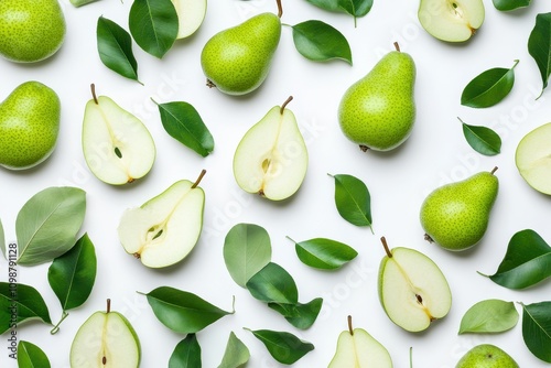 Halved and sliced green pear on a white background viewed from above