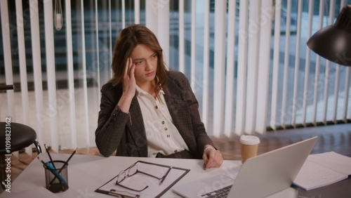 A Businesswoman Feels Fatigue Working on a Computer in a Modern Office. Highlighting the Importance of a Flexible Work Schedule and Recovery Resources to Combat Fatigue. Stress Management Needed.