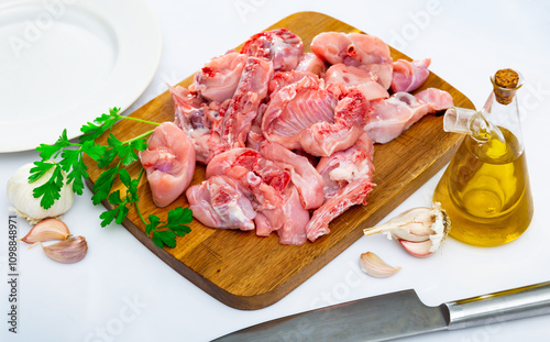 Raw fresh minced rabbit with onion and spices on board photo