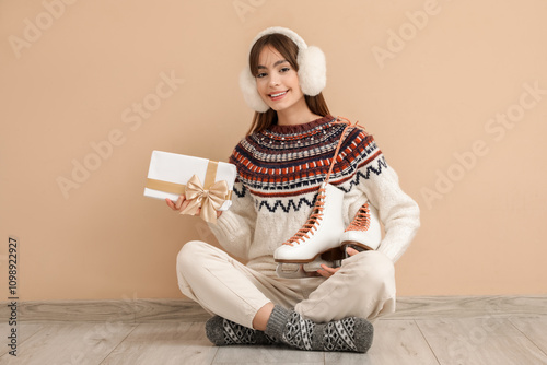 Young woman with ice skates...