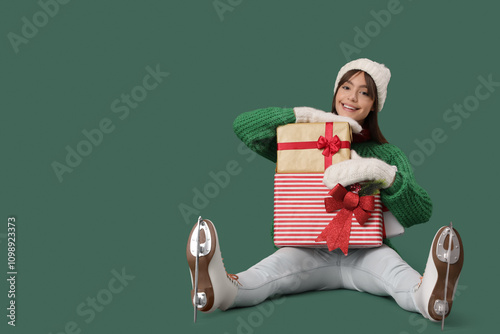 Young woman with ice skates...