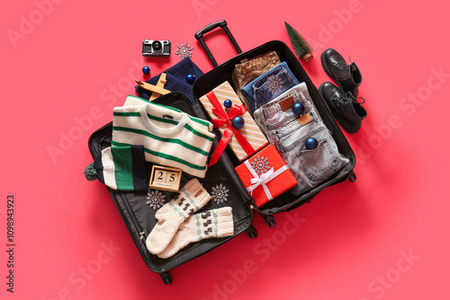 Suitcase with winter clothe...