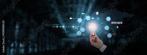 Open Data: Transparency, accessibility, collaboration, data sharing, innovation, digital transformation. Businessman hand holding creative light bulb with innovative technology.