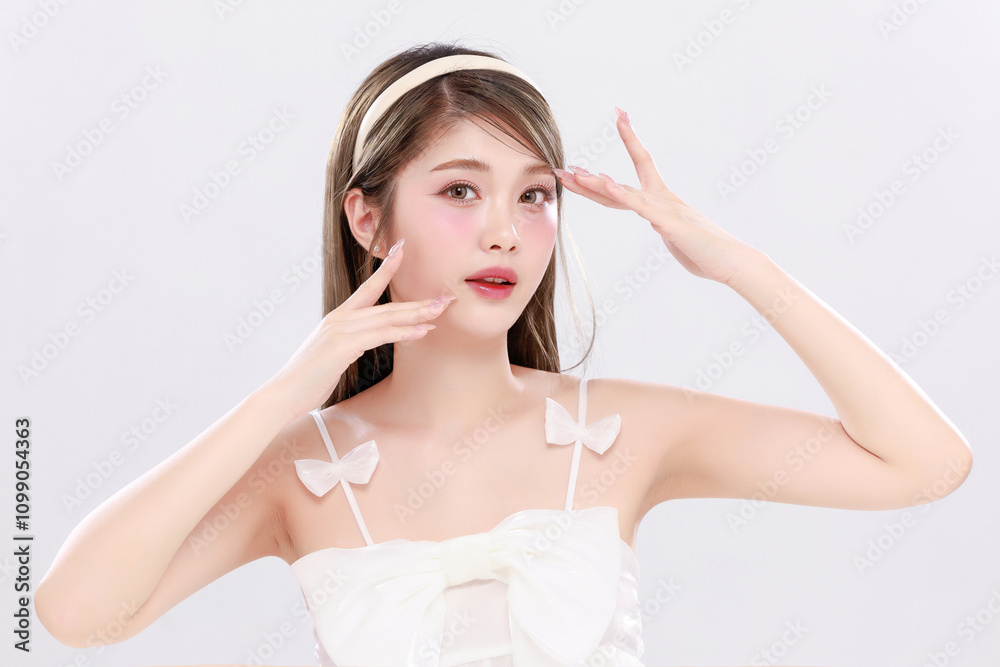 Naklejka premium Beautiful young Asian woman model long hair with natural makeup on face clean fresh skin on isolated white background.