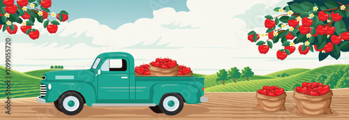 A vintage truck loaded with apples in an orchard with fruiting apple trees