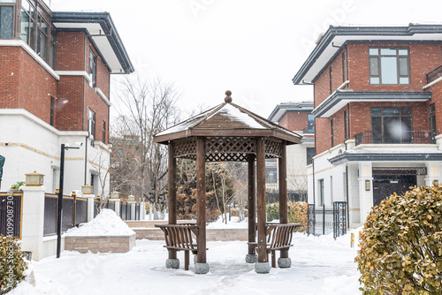 A villa courtyard in falling snow photo