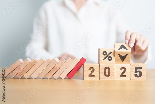 block falling on 2025 year and percentage UP and Down arrow. Interest rate, GDP, stocks market, financial, deflation and Inflation, mortgage, debt, Loan, crisis, risk and Economic Recession concept