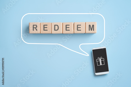 фотографія REDEEM text on wooden cube blocks inside speech bubble line with white smart pho