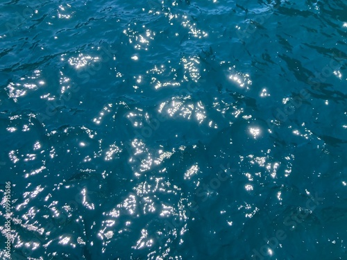 The deep blue-green sea shimmers like an oil painting when the morning sunlight shines through it