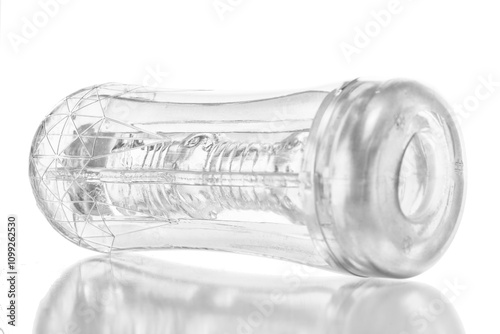 transparent silicone masturbator in a plastic case on a white background photo