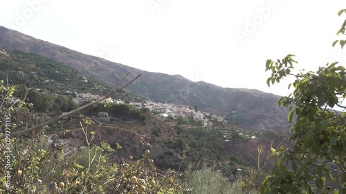 Lanjaron village under Sierra Nevada mounatin range in la Alpujarra, Anadalusia, Spain. High quality 4k footage photo