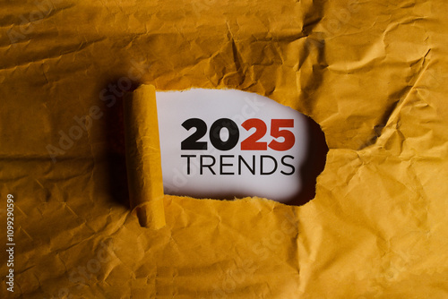 A yellow envelope with a torn section revealing the text 