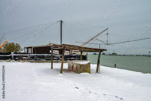 Quadro su tela A Peaceful Seaside Landscape Covered in Snow After a Winter Storm