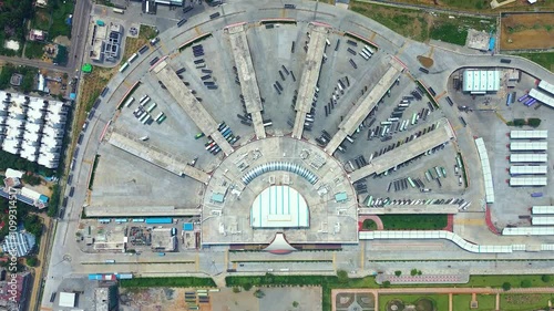 A top-down aerial view of the vast Kalaignar Centenary Bus Terminal in Kilambakkam, Chennai. India's largest bus terminal, which has an organized transit infrastructure and a transportation hub. photo