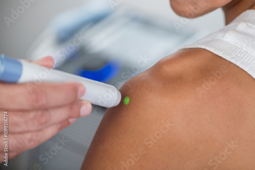 Wallpaper Mural A physical therapist performs laser therapy on a patients shoulder to reduce pain, decrease inflammation, and promote tissue healing, aiding in faster recovery and improved mobility Torontodigital.ca