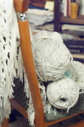 Knitting threads are lying on the chair