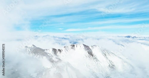 Aerial view winter landscape of Jiajin mountain in Sichuan China with mist floating in the air snowy mountain range photo