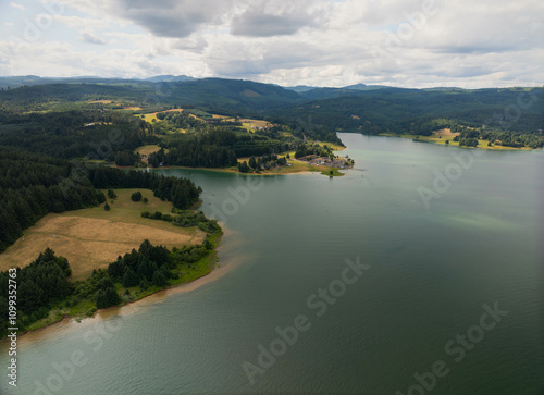 A beautiful lake with a small town on the shore photo