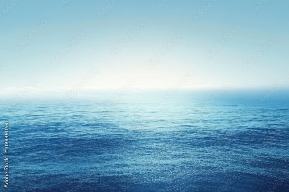 Fototapeta premium A serene, wide-angle view of a calm ocean with a blue sky and a gentle horizon.