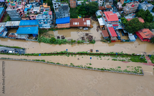 Drone view of the Bagmati River flooded and affected the riverbanks and homes during heavy rainfall in Kathmandu, Nepal. photo