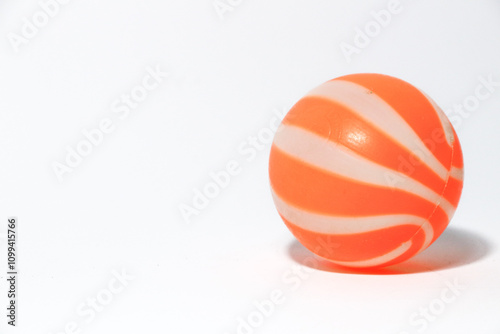 ittle orange ball isolated on a white background