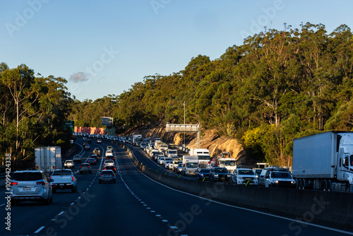 Busy multi lane highway road in approaching Sydney with traffic bumper to bumper