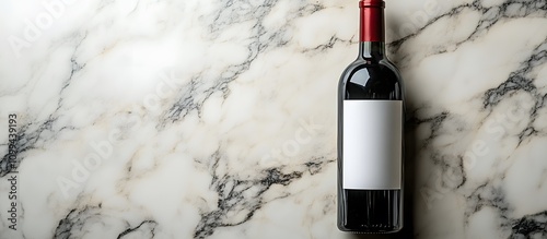 Red wine bottle on marble background. (1)