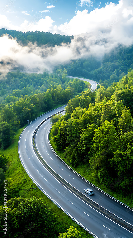 Fototapeta premium Dynamic development of a multilayered flyover highway surrounded by lush green forests nature landscape aerial view infrastructure progress