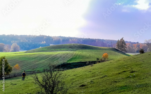 Tourist walking over Kashubian hills. Northern Poland photo