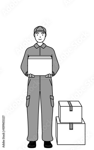 A mechanic in coveralls working to carry cardboard boxes