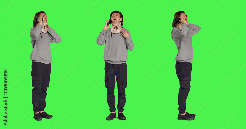 Obraz premium Person with neck collar brace answers call on mobile phone, talking to friends about his bone fracture incident. Hurt man wearing cervical foam chatting on telephone line, greenscreen.