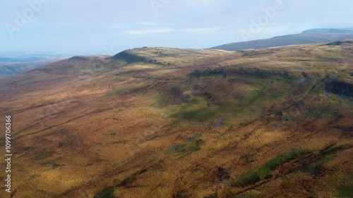 Dramatic Aerial View of Brecon Beacons Bannau Brycheiniog Black Mountain Landscape with Rocky Rugged Terrain in Wales UK. Hiking, Travel, Drone Footage 4K. photo