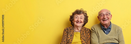 Crazy smiling senior couple with glasses, isolated yellow color background, image with space for text	
