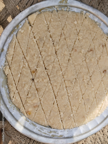 suji halwa making by indian muslim for shab e barat festival. photo