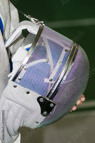 Detail of a fencing costume helmet photo