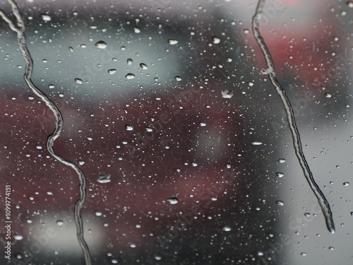 heavy rain slow motion on car window while driving