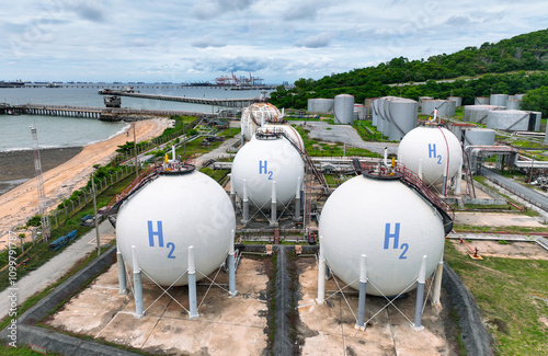 Green hydrogen storage facility with industrial H2 gas tanks in sustainable energy plant. Zero emission technology for clean energy production. Sustainable energy infrastructure and clean power. photo