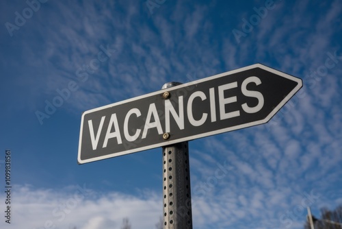 Vacancies word written on a signboard, business and job career concept. photo