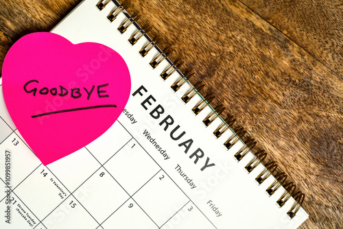 Valentines day calendar with the message Goodbye, on a pink heart shaped post it note.  photo