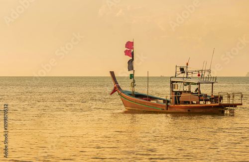   Fisherman boats moored floating on tropical beach while sunset time at Bang Makham Beach Samui, Thailand photo