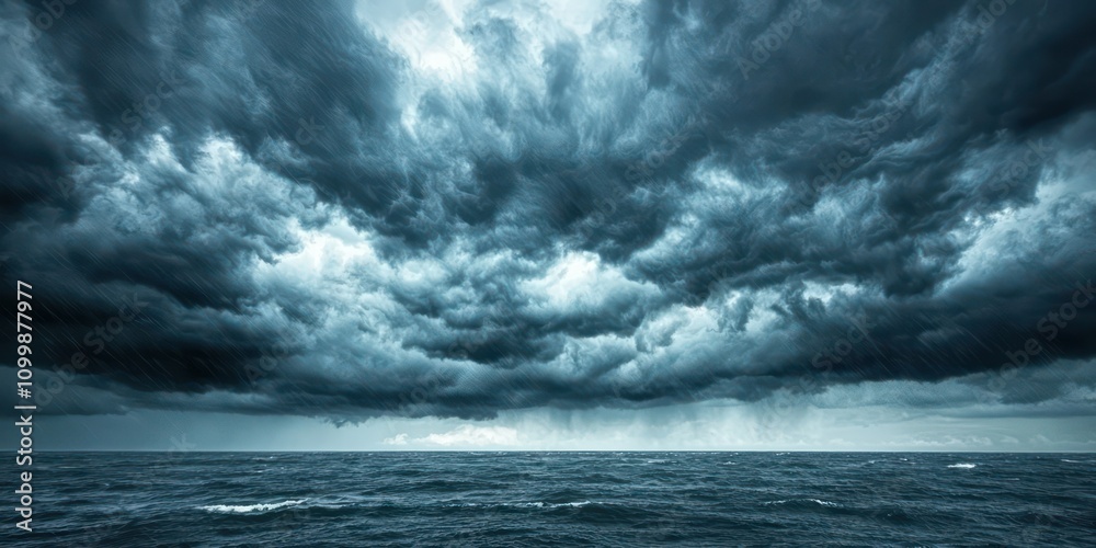 Fototapeta premium Dark, thick storm clouds gathering over a vast plain, creating a sense of impending rain and thunder.