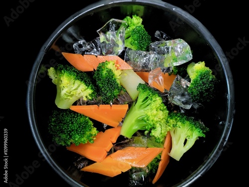 Fresh vegetable broccoli and carrot contain many vitamins that are good for the body photo