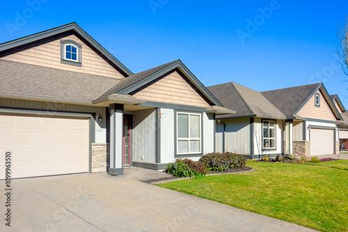Row of nice residential houses on bright winter day in British Columbia, Canada