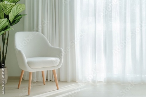 White wooden chair beside a large window in a green room setting