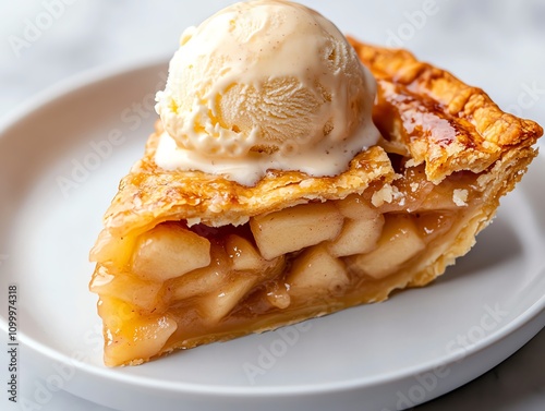 A slice of apple pie with a scoop of vanilla ice cream melting on top photo