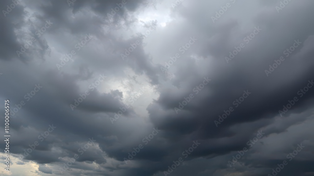 Fototapeta premium Dark stormy clouds gathering in the sky, creating a textured and dramatic atmosphere, atmosphere, gathering