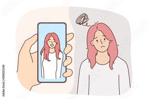 Problem of low self-esteem in upset woman standing near beautiful portrait in mobile phone